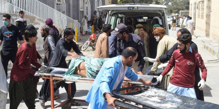At least 52 killed after blast rips through religious procession in restive southwest Pakistan